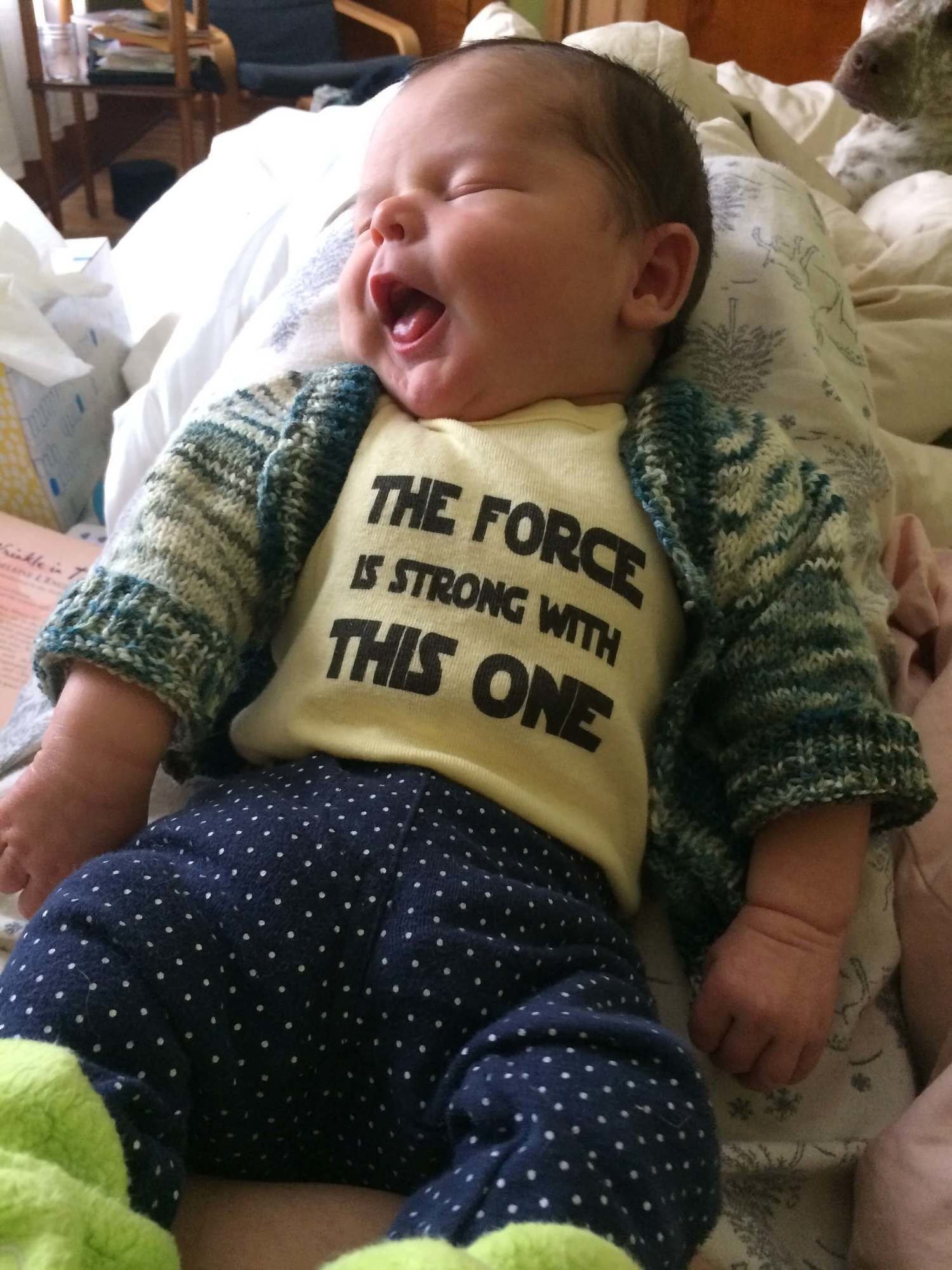 Avi wearing a shirt that says "The force is strong with this one"